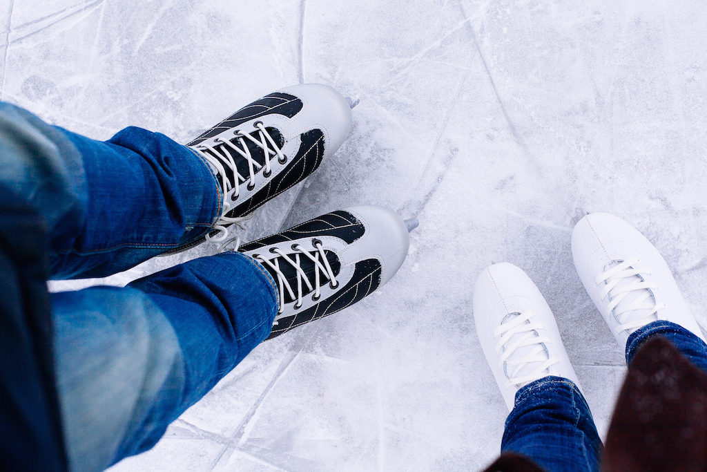 man and woman with ice skates, ice skating