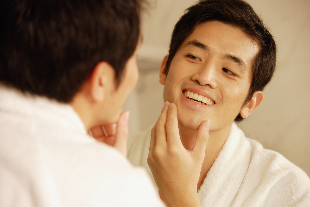 Man Touching Face Habits That Increase Flu Risk