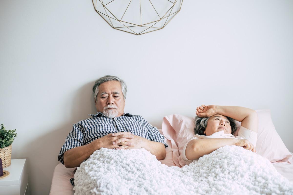 older couple fighting in bed men's health concerns over 40