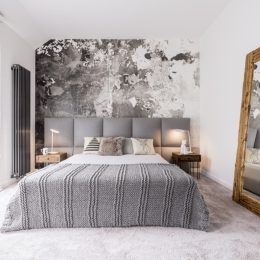small well designed monochromatic modern bedroom with a wooden mirror against the wall, Joanna Gaines tips