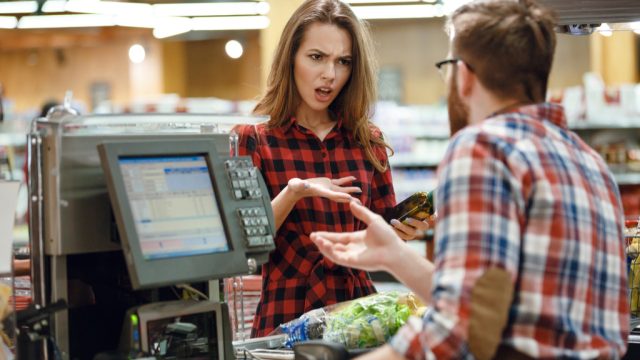 woman angry with cashier