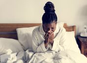 woman sick in bed exposed to serious flu risk