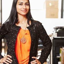 Woman with hands on hips, showing confident body language