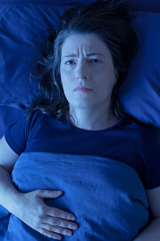 Woman with Restless Leg Syndrome Fidgeting
