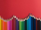 colored pencils against a red background - color facts
