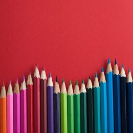 colored pencils against a red background - color facts