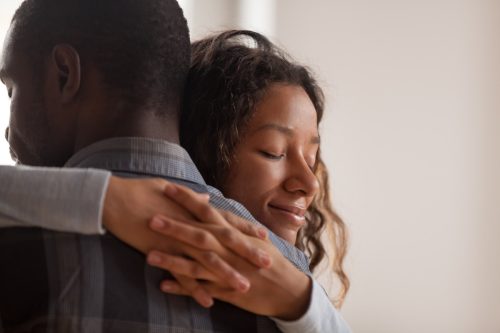 Couple hugging and making up after a fight