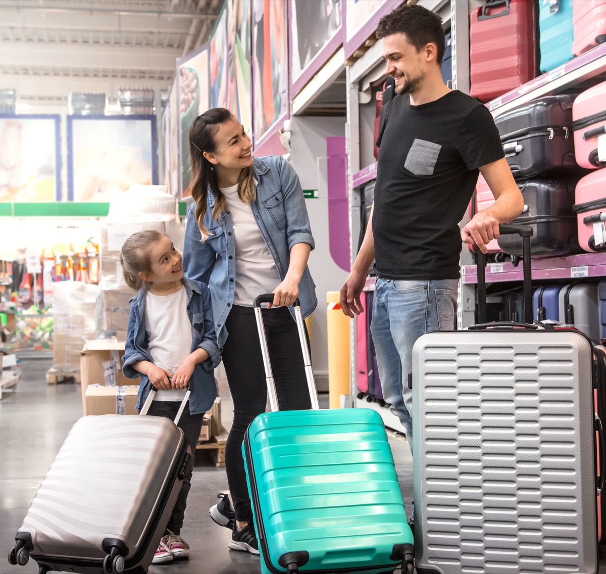 Family buying luggage in a store