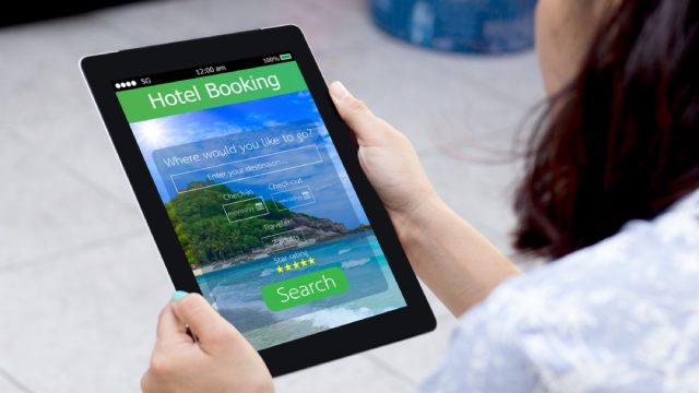 woman books hotel reservation online