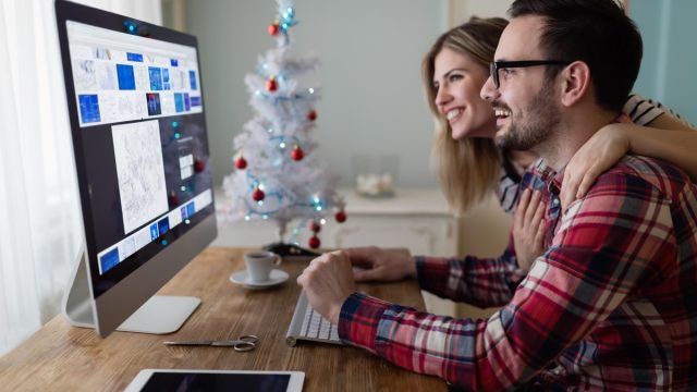 Man and woman working hard and staying productive over holiday
