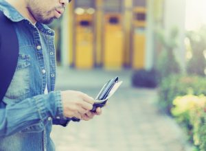 man with a beard pulling cash out of his wallet, worst things about the suburbs