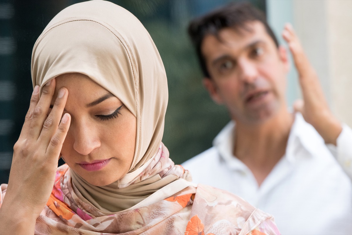 Muslim woman and man arguing