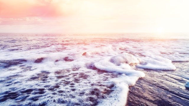 ocean waves on beach at sunrise - why is the ocean salty