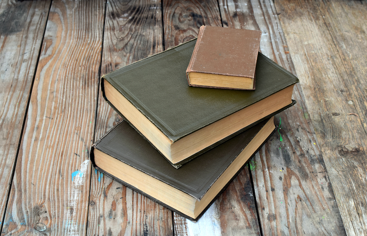 old dusty books on wood table