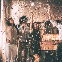 people celebrating all the good news in 2018 with a confetti party