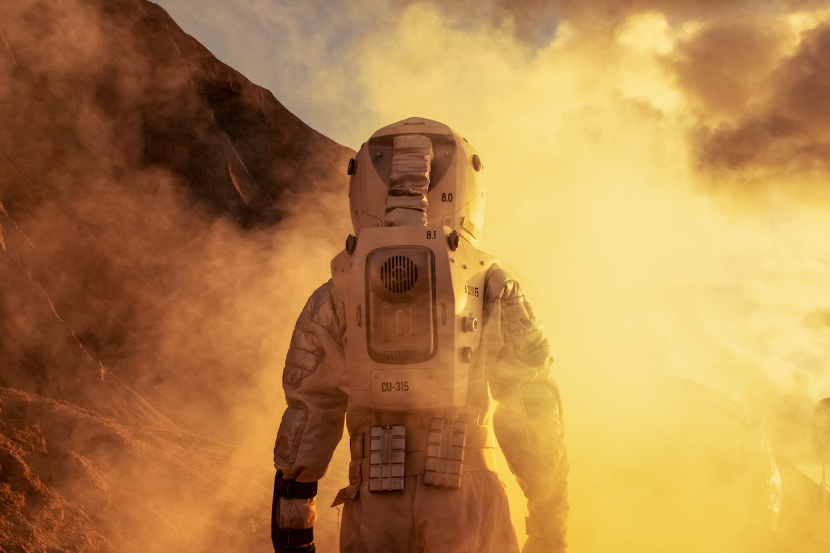 an astronaut stepping foot on mars