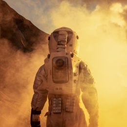 an astronaut stepping foot on mars