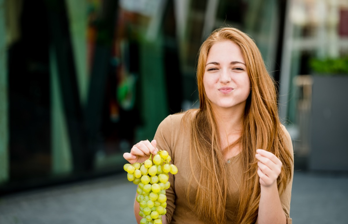 Woman Eating Grapes {New Years Eve Traditions}