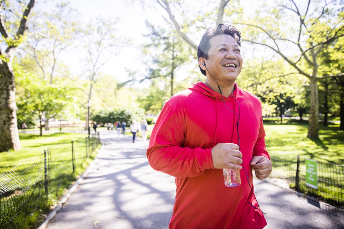 older asian man running in the park