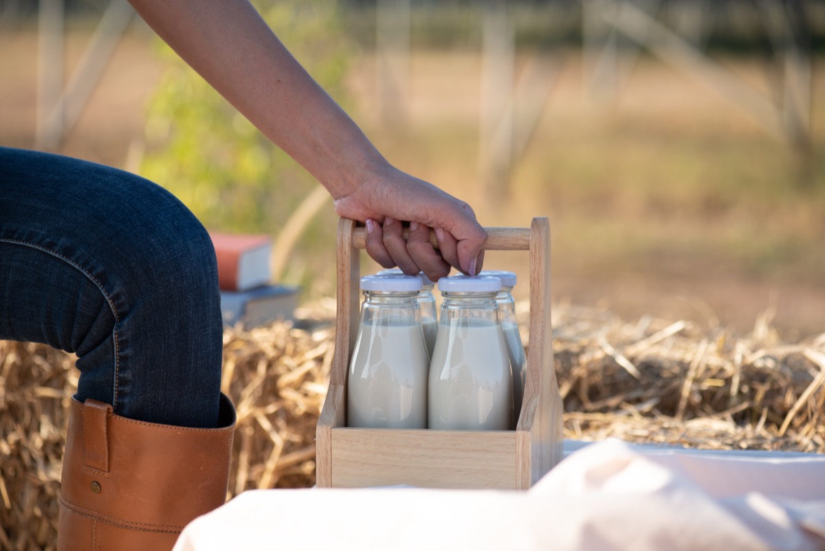 Milk woman with milk bottles