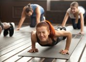 woman doing push ups and looking upset