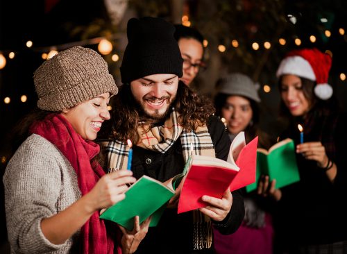 Mexican Posada, friends Singing carols in Christmas in Mexico