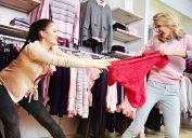 two women fight over an item while shopping in a nightmare experience