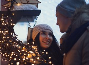 Young couple at a Christmas market, a tradition