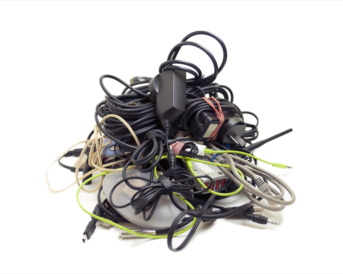 Pile of old electronics cables and chargers