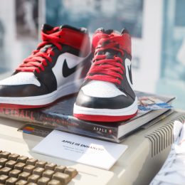 MOSCOW-6 AUGUST, 2016:Rare Nike Air Force 1 basketball sneakers in black, white & red colors.Nike basketball fashion shoes on stand at fashion exposition.Fashionable foot wear for youth & Apple II pc - Image