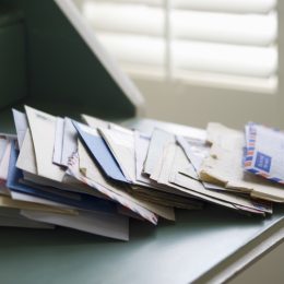 Pile of Mail on a Desk {Secrets Your Mailman Knows}