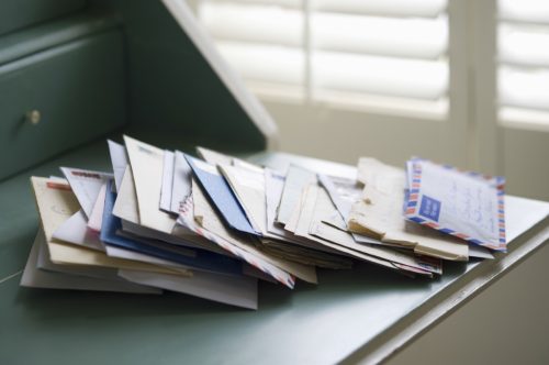 Pile of Mail on a Desk {Secrets Your Mailman Knows}