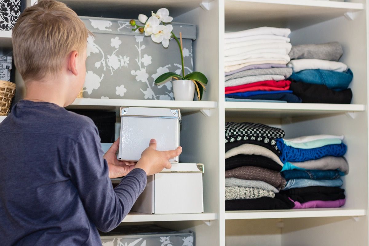 https://bestlifeonline.com/wp-content/uploads/sites/3/2019/01/boy-storing-items-for-storage.jpg?quality=82&strip=all