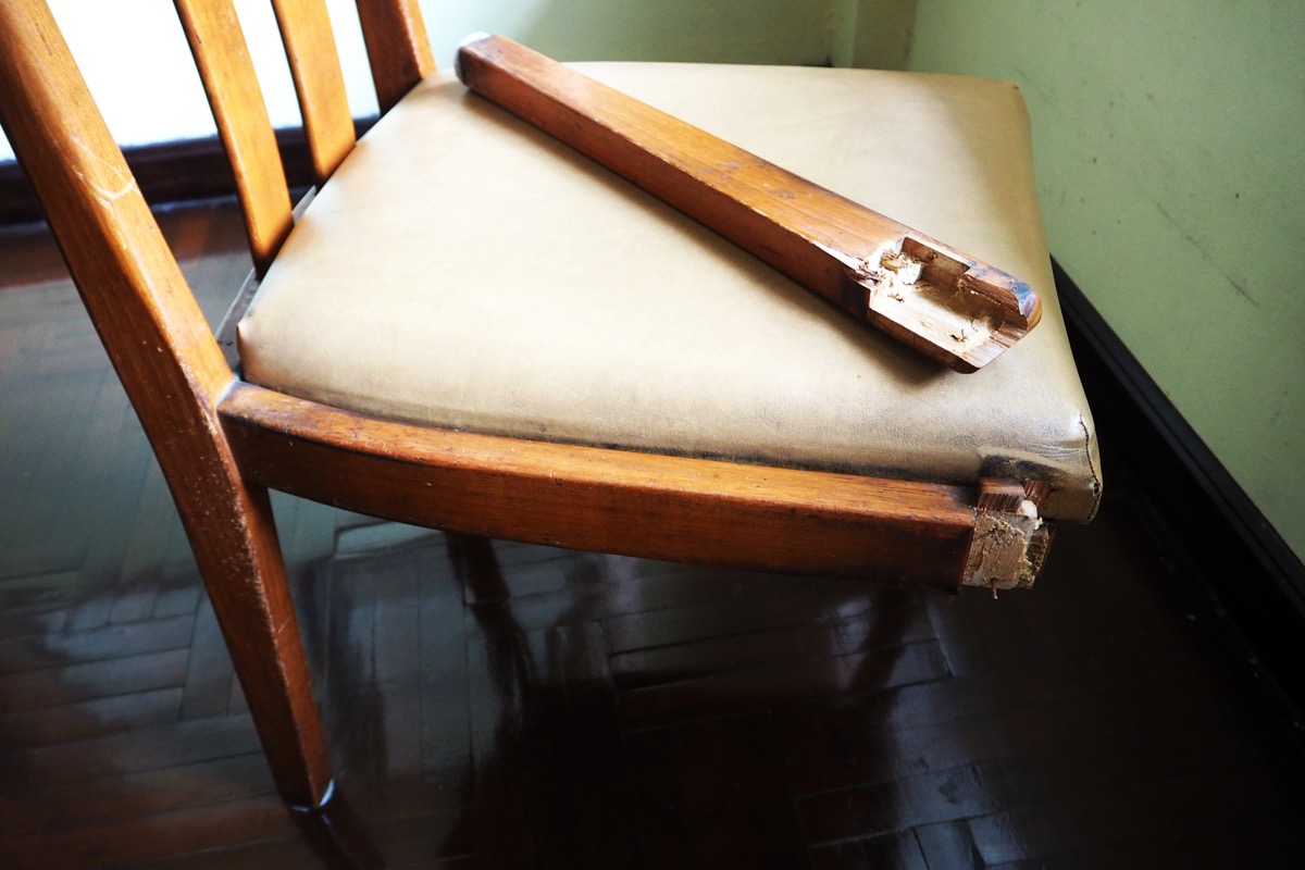 wooden chair with broken leg
