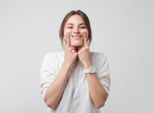woman smiling on white background, what do you call jokes