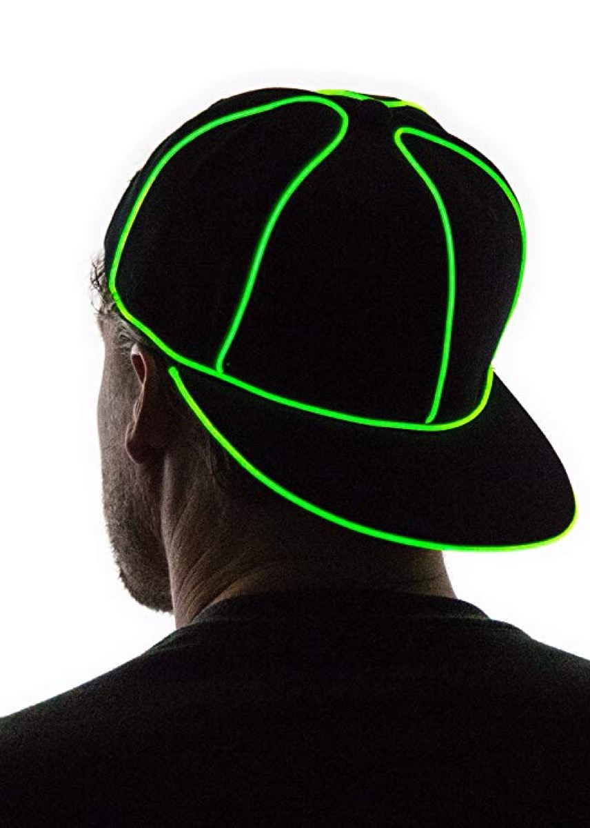 a man in a black and green glow in the dark hat