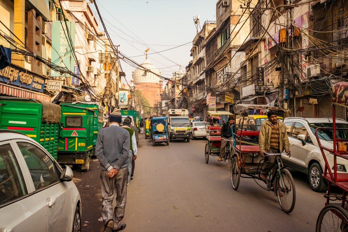 Chaotic traffic in Chandni Chowk market, Street with people and traffic at historical part of old Delhi area, India