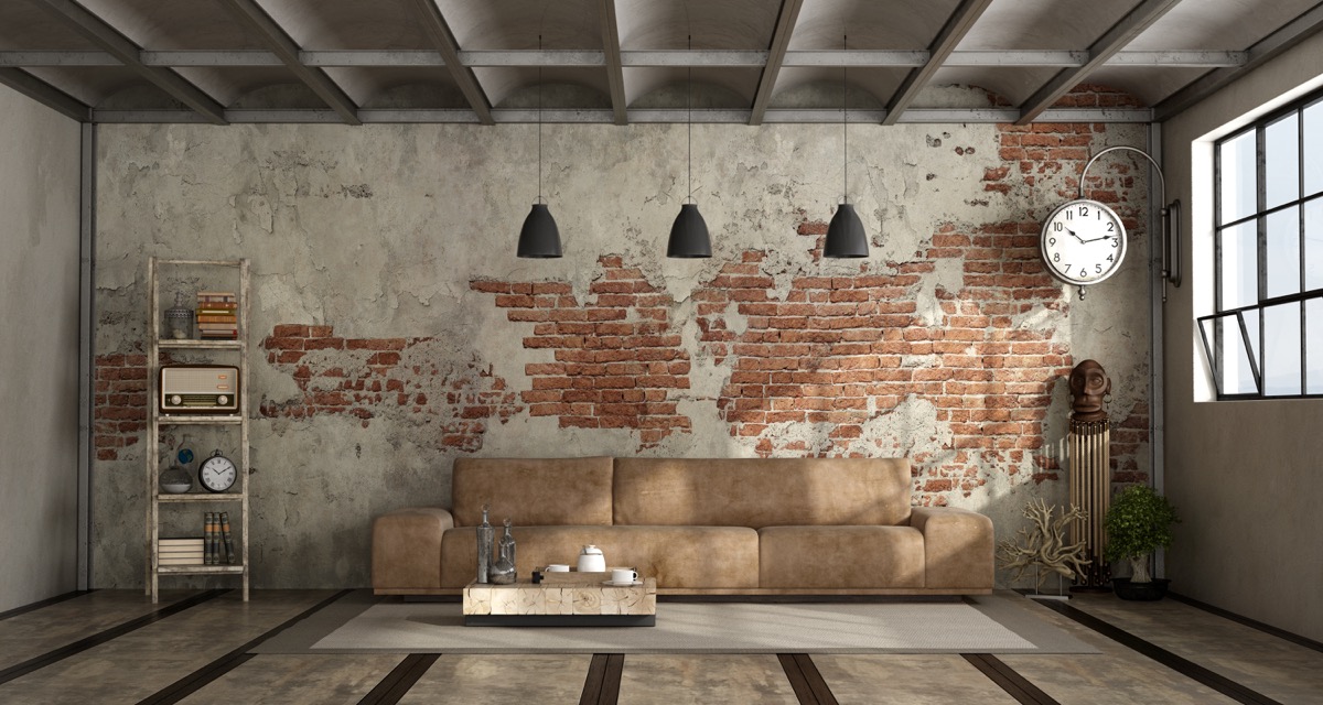 Living room in industrial style with leather sofa and brick wall