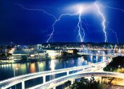 a striking image of lightning strikers over brisbane australia