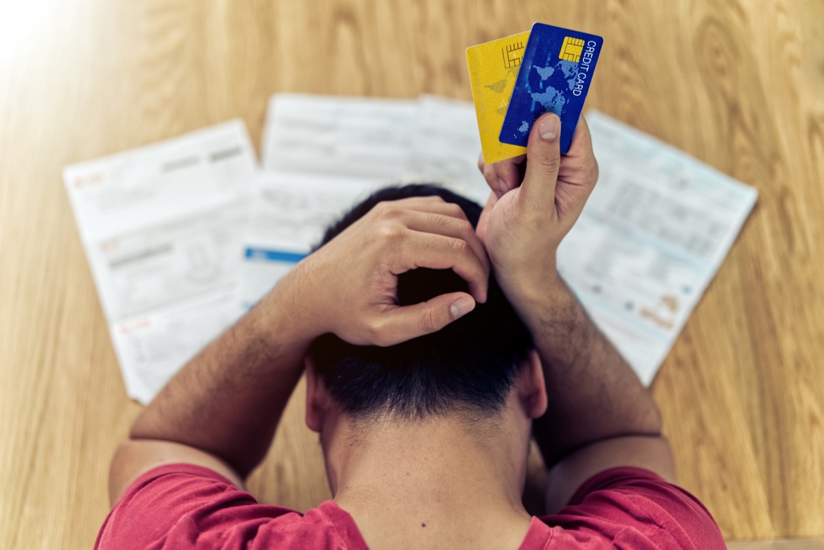 Man stressing over his bills and credit cards