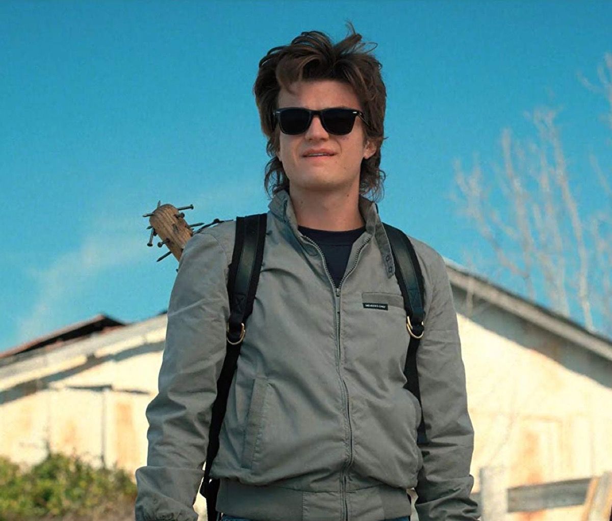 Joe Keery wearing members only jacket in stranger things