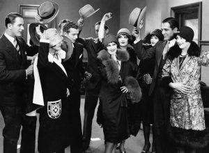 a group of men tipping their hats to a group of women