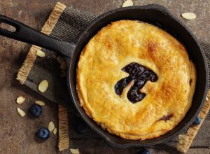 Pi Day special homemade blueberry pie baked in a skillet overhead view