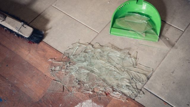 Person Sweeping Up Broken Glass {Get Rid of Old Stuff}