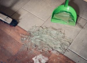 Person Sweeping Up Broken Glass {Get Rid of Old Stuff}