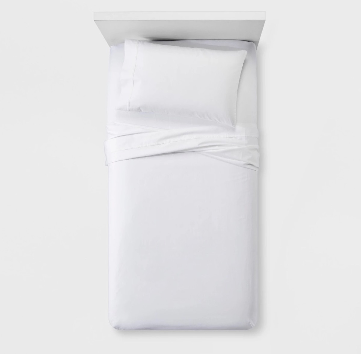 white sheets on a twin bed