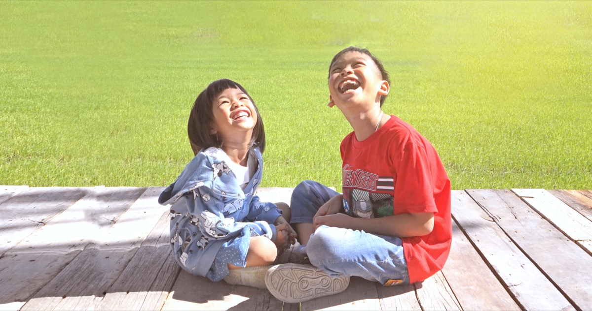 Singburi THAILAND ,1 1 ,2019: THAILAND Kids Playing Cheerful Park Outdoors .They happiness and laugh on wooden balcony in the Sing buri garden - Image