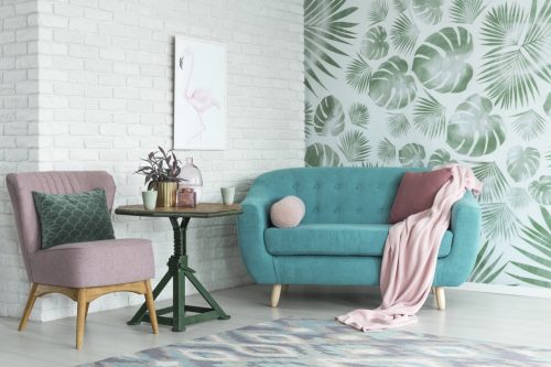 Living room with fern wallpaper and exposed brick