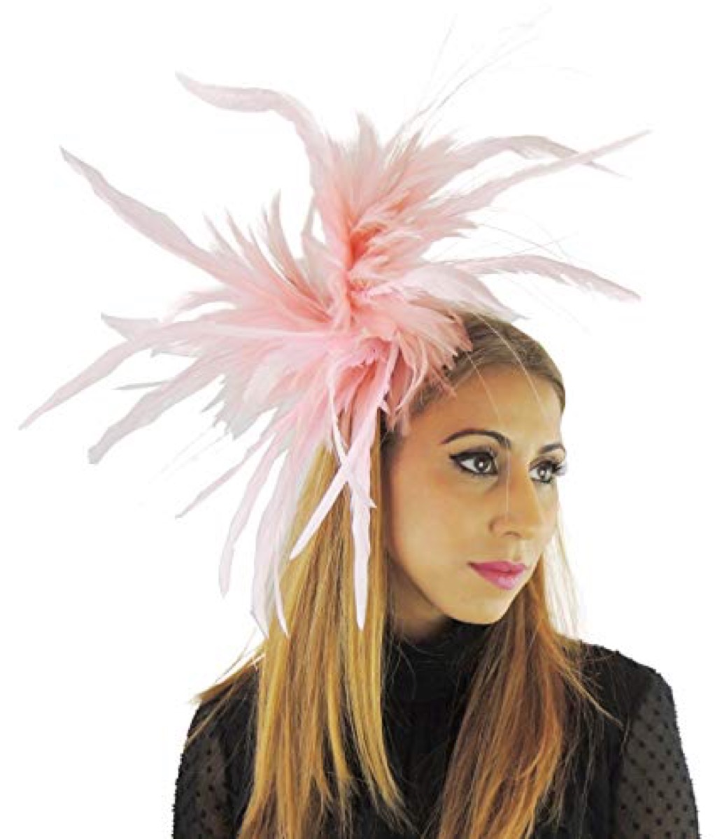 woman in a pink fascinator feather hat