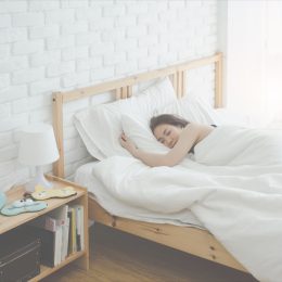 woman sleeping in a bed, subtle symptoms of serious disease